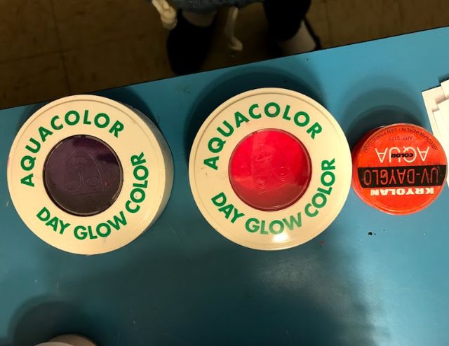 Assorted water-activated paints in neon colors.
